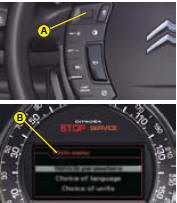 The instrument panel B is located in the centre of the dashboard.